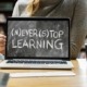 Laptop screen saying (N)ever (S)top Learning